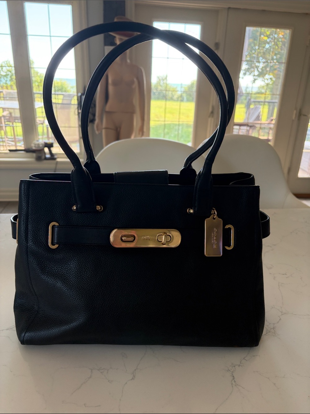 Coach Black Leather Satchel with his Gold-Tone Hardware and Top Handles